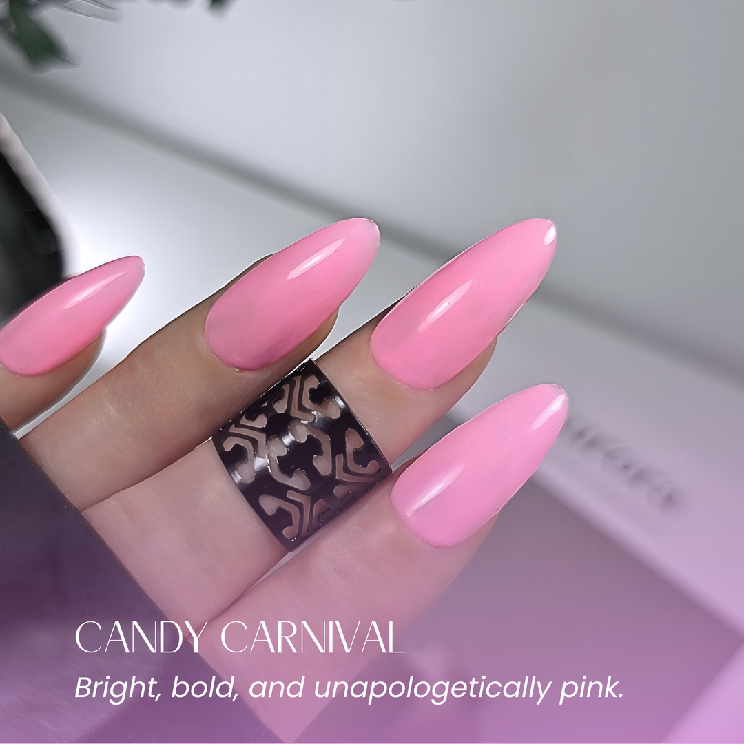 Soft-focus hand in white ruffled sleeve showing glossy bright pink nails.