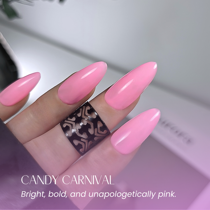 Soft-focus hand in white ruffled sleeve showing glossy bright pink nails.