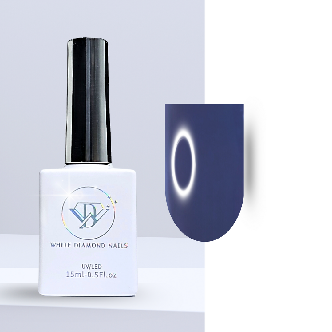 A bottle of White Diamond Nails gel polish in Came Out of the Blue, shade 214, featuring a sleek white design with a holographic logo. The polish showcases a rich, creamy navy blue hue, perfect for a bold and sophisticated manicure, set against a clean background.