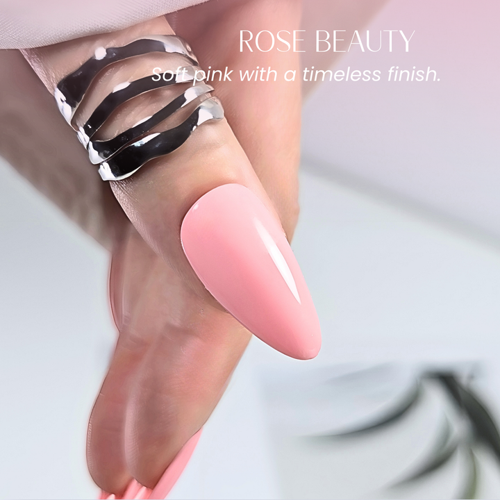 Hand with almond-shaped nails painted in White Diamond Nails 124 Rose Beauty soft pink gel polish.