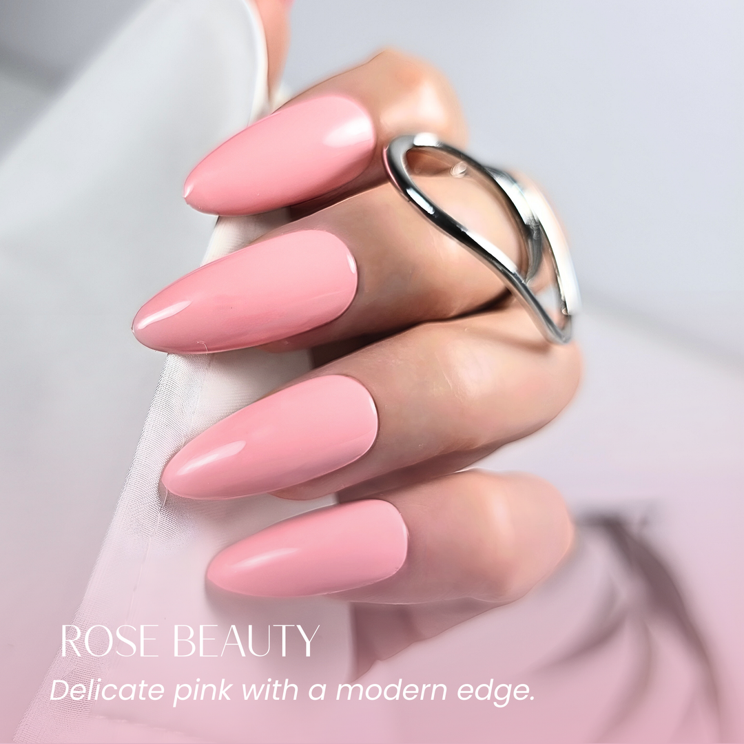Hand with almond-shaped nails painted in White Diamond Nails 124 Rose Beauty soft pink gel polish.