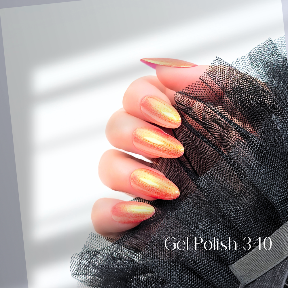Hand with almond-shaped nails painted in White Diamond Nails Picturesque Sunset Gel Polish 340, glowing golden orange cat eye shimmer, under natural light.