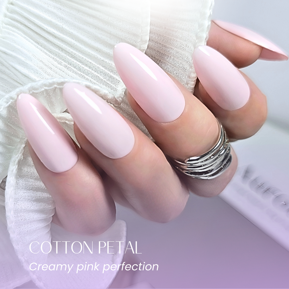 Hand pose in pastel pink Cotton Petal gel polish, white background