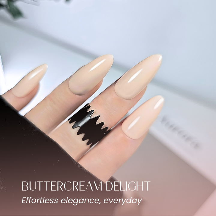 Elegant nail set in buttercream beige with soft white background