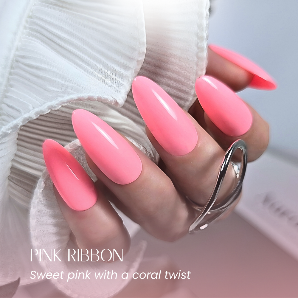 Full hand pose in Pink Ribbon gel polish with white pleated sleeve and silver ring