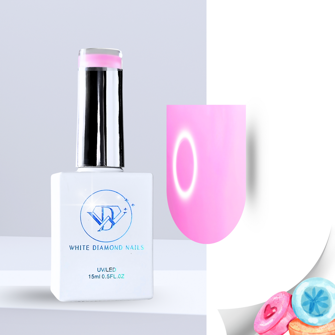 A bottle of White Diamond Nails Marshmallow Blush color base gel, featuring a sleek white design with a chrome cap. The swatch displays a soft, milky pink hue with a smooth, luminous finish. Pastel-colored candies in the corner emphasize its sweet, marshmallow-inspired scent.