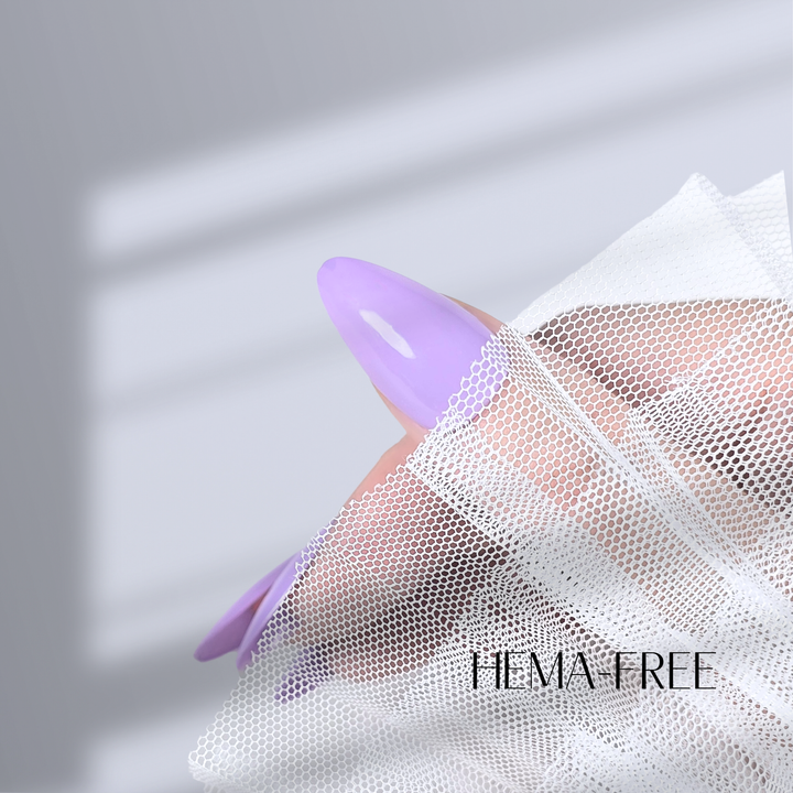 A single manicured nail painted with Gel Polish S201, showcasing a glossy lavender finish, complemented by soft white lace in a bright background.