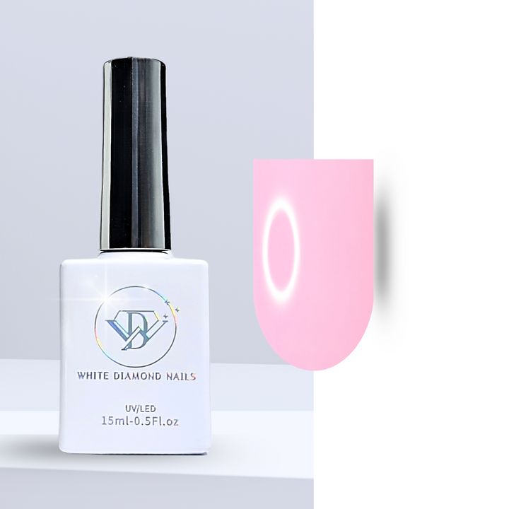 A bottle of White Diamond Nails gel polish in Pebble Pink, shade 117, featuring a sleek white design with a holographic logo. The polish displays a soft, muted pink tone with a creamy finish, perfect for an understated, elegant look, set against a clean background.