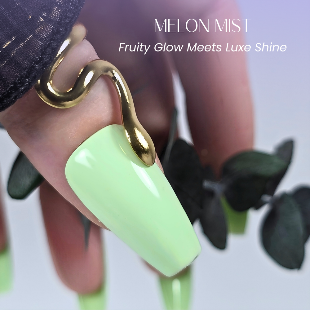Glossy mint green nails in Melon Mist shade with a gold snake ring and eucalyptus accents. Caption: “Fruity Glow Meets Luxe Shine.”