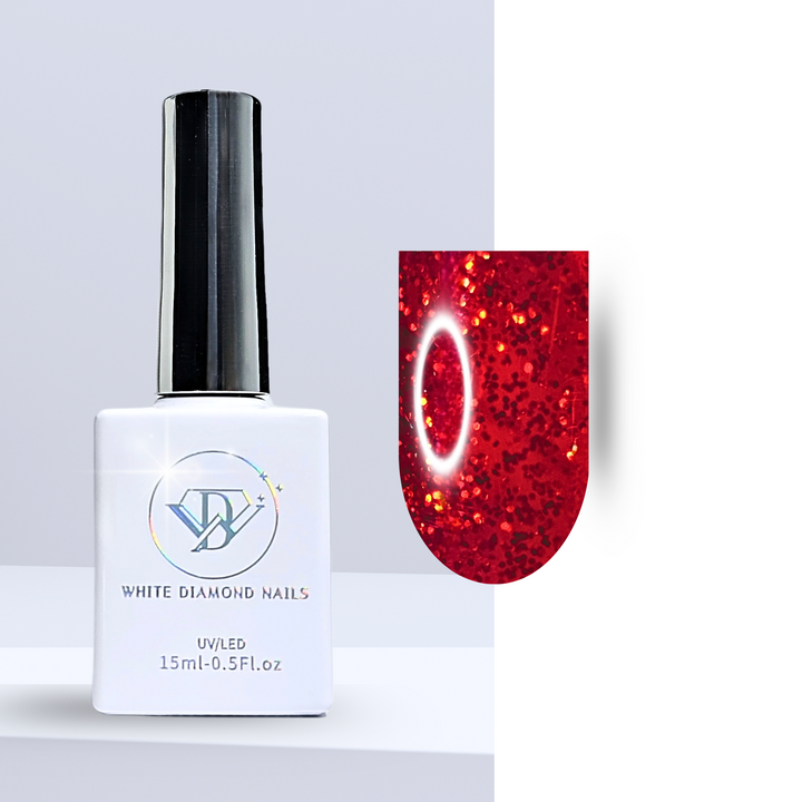 A bottle of White Diamond Nails gel polish in Ruby Shoes, shade 333, featuring a sleek white design with a holographic logo. The polish showcases a translucent glass red hue infused with fine golden glitter, perfect for a bold and luxurious manicure, set against a clean background.