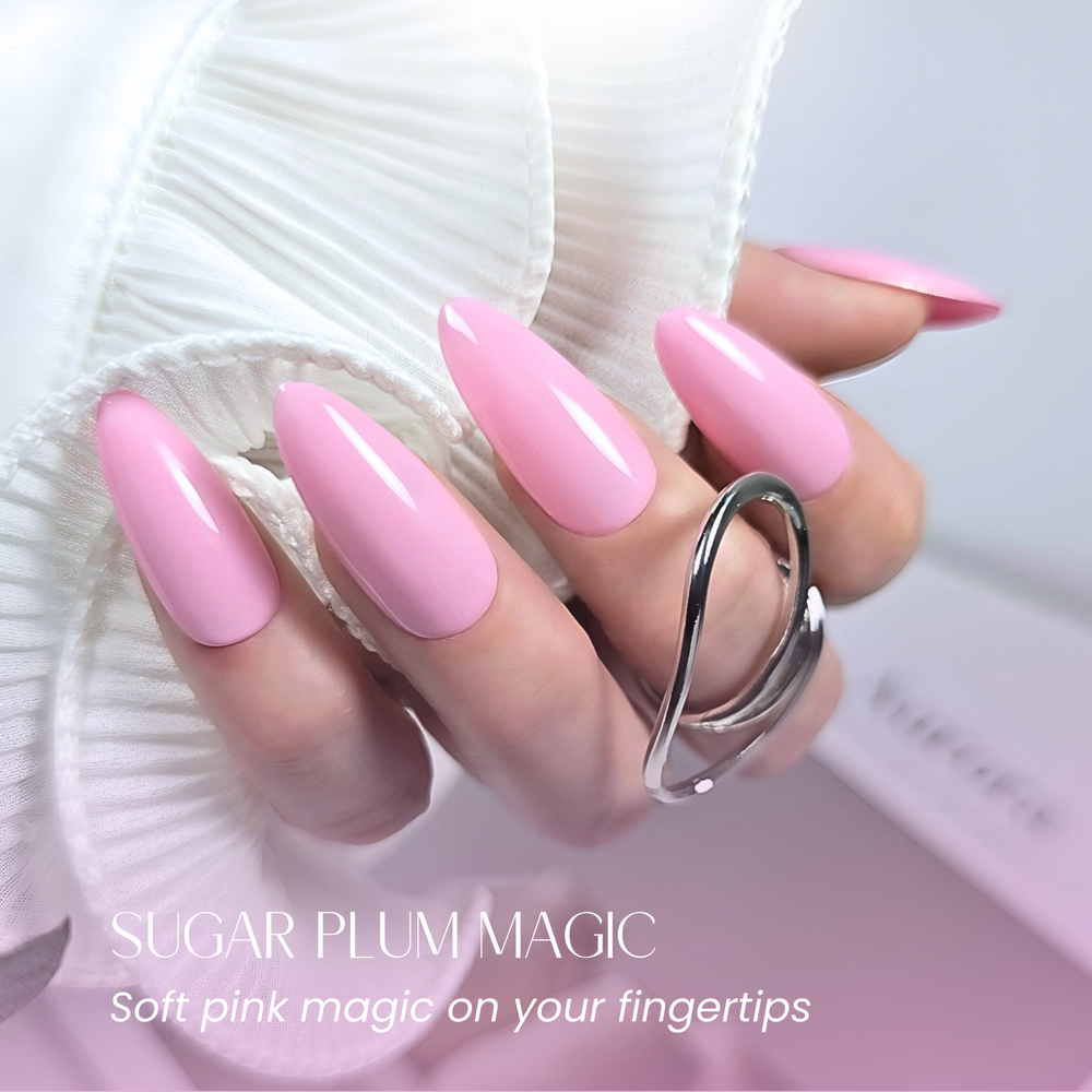 Hand with almond-shaped nails painted in Sugar Plum Magic, wearing a silver loop ring