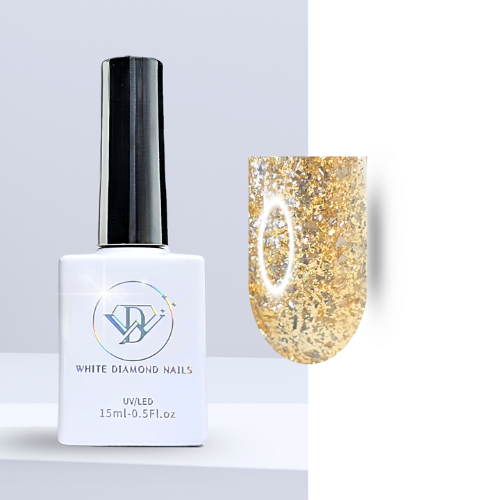 A bottle of White Diamond Nails gel polish in Golden Cascade, shade 325, featuring a sleek white design with a holographic logo. The polish has a clear base with a subtle golden tint, packed with gold and silver glitter flakes, perfect for a radiant and luxurious manicure, set against a clean background.